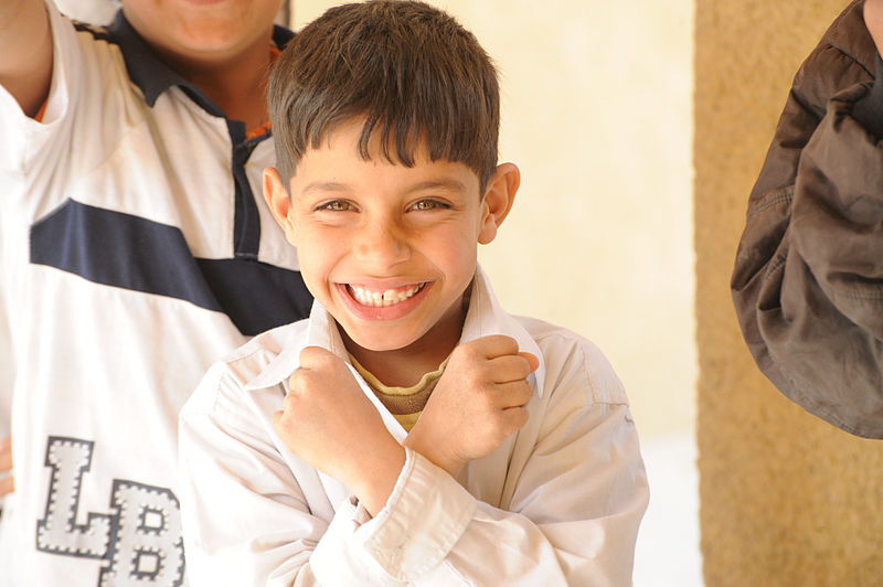 File:Soldiers, Iraqi national policemen distribute school supplies in Baghdad DVIDS157215.jpg