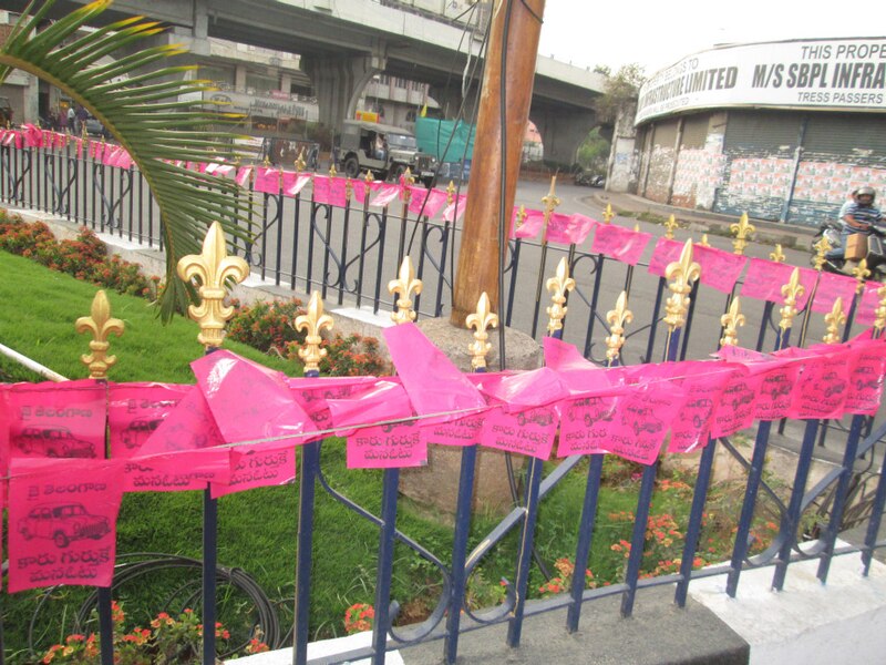 File:Streetside railings with TRS flags.JPG