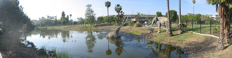 Panorama of a tar pit pond with sculptures of prehistoric mammals in Hancock Park. Tar-eleph-pano.jpg