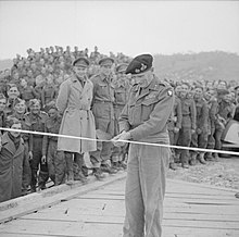 General Montgomery cuts the tape to officially open the Bailey bridge constructed over the Sangro river, 14 December 1943. The British Army in Italy 1943 NA9796.jpg