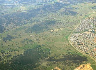 Aerial view from the north west of Throsby photographed in 2009 with Horse Park Drive and the suburb of Harrison to the right Throsby aerial NW.jpg