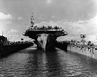 USS Makin Island halfway into USS ABSD-6, at Guam, 8 June 1945. USS Makin Island (CVE-93) enters floating drydock ABSD-6 at Guam on 8 June 1945 (NH 99118).jpg