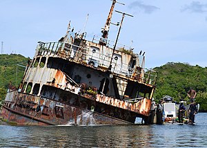 US Navy 120125-N-XX999-018 embarked aboard the rescue and salvage ship USNS Safeguard (T-ARS 50) check on progress of water being pumped from the e.jpg