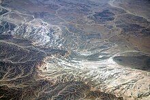 Example of a Wadi in Egypt, present day. A wadi is an area of land that is seasonally flooded. This flooding enriches the soil and makes it an ideal place for vegetation. Wadi East Egypt.jpg