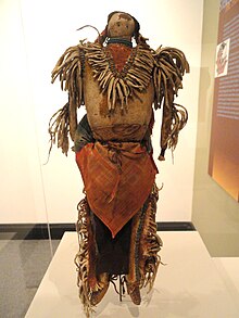 Lakota doll of a warrior figure, displayed at the Peabody Museum. Warrior doll, with symbols of Lakota religion - Native American collection - Peabody Museum, Harvard University - DSC05413.JPG