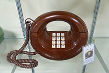 A brown Western Electric "Sculptura" Design Line telephone Western Electric Donut - Telephone Museum - Waltham, Massachusetts - DSC08116.jpg