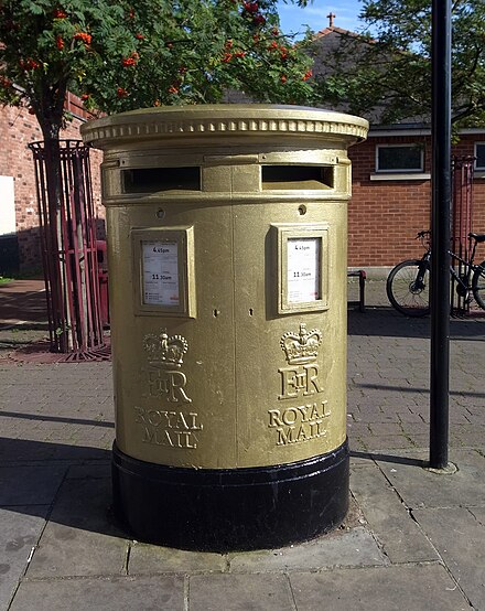 Post box in Wrexham painted gold to celebrate Tom James' gold medal win at the 2012 Summer Olympics