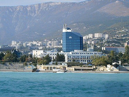 Hotel Oreanda is the large four-story yellow building in the foreground YaltaLivadiyski.jpg