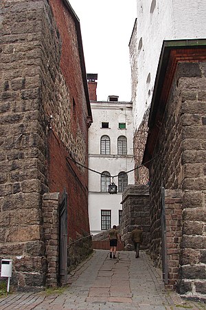A narrow alley of the Vyborg Castle in Vyborg, Russia