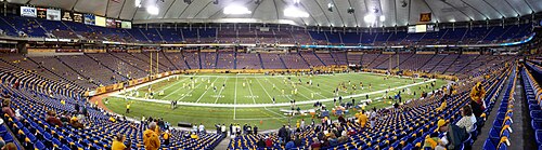 The Metrodome in 2008, before the 91st battle for the Little Brown Jug rivalry game between the Minnesota Golden Gophers and Michigan Wolverines. 2008-1108-MN-MI-MetrodomePan01.JPG