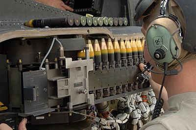 30mm × 113 mm rounds being loaded into a M230 chain gun