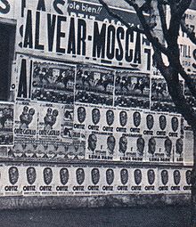 Campaign posters festoon a Buenos Aires wall in 1937. Alvear-mosca-1937.jpg
