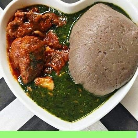 Amala (yam swallow), ewedu (soup made from jute leaves) and assorted meat.