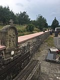 Way of the Cross in the cemetery wall