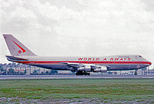 A Boeing 747-273C of World Airways at Miami International Airport in 1974 wearing the early red color scheme. Boeing 747-273C N748WA World MIA 200474 edited-4.jpg