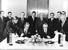 On 19 December 1975, the permanent representative Gunter Gaus signed an agreement on transit fees with the head of department in the East German Ministry of Finance, Hans Nimmerich, in the House of Ministries. Bundesarchiv Bild 183-P1219-0310, Berlin, Unterzeichung Abkommen Transitgebuhrenpauschale.jpg