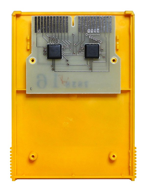 An opened Fairchild Channel F ROM cartridge, illustrating the ROM chips mounted to a circuit board within the casing. The cartridges were inserted int