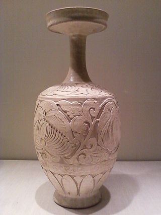 <i>Vase with carved peony scrolls</i>