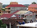 Construction Workers with Downtown Backdrop - From Roof of Savet 1 Guesthouse - Stung Treng - Cambodia (48444622792).jpg