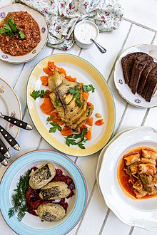 Dishes of Odesa cuisine: gefilte fish, helzel, aubergine dip, cabbage rolls "little fingers" Cuisine of odessa dishes.jpg