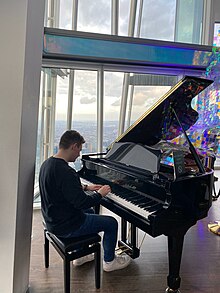Daniel James Collins playing the piano on the 69th floor of The Shard, London, England