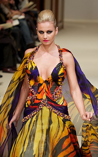 Model in a designer gown reflecting the contemporary fashion trend at an Haute couture fashion show, Paris, 2011 E1266601 (5398889640).jpg