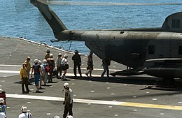 Evacuees board a CH-53 on USS Midway Evacuees from Naval Station Subic Bay boarding an HMH-772 CH-53 on the USS Midway.JPEG