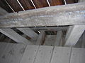 Bottom of diagonal truss members interlock with floor (Fallasburg Bridge)