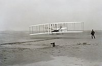 December 17: The Wright Flyer in the air, the first airplane flight, by Orville Wright. First flight2.jpg