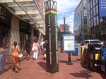 The lines a station services are represented by the colors below the Metro logo on the station's exterior signs. Gallery Place (WMATA station).JPG