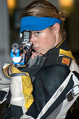 Hattie Johnson aiming her air rifle. She competed in the women's 10 m Air Rifle competition at the 2004 Summer Olympics in Athens, Greece
