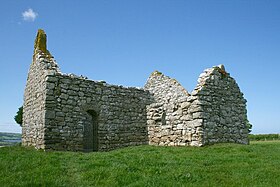 The ruined chapel, showing the doorway and the 16th-century side chapel (to the right)