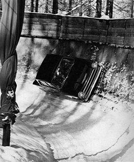 Henry Taylor driving a Ford Cortina down the bobsleigh run at Cortina d'Ampezzo.jpg