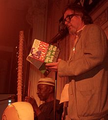 Holman performing with Papa Susso at the Bowery Poetry Club in 2016 Holman & Susso.jpg