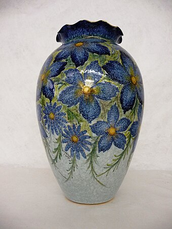Italian red earthenware vase covered with a mottled pale blue glaze