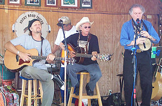 Joel Rafael (center) with Jimmy LaFave (guitar) and David Amram (flute) performing at the Woody Guthrie Festival in Okemah, OK. - July 15, 2006. JoelRafael-sm.jpg