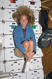 Karen Nyberg weightless on the middeck of Discovery while docked with the ISS Karen Nyberg STS124 - 2008June07 (NASA S124-e007134).jpg