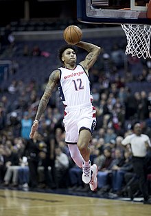 Oubre jumps for a slam dunk in 2016 Kelly Oubre Jr. (31653577295).jpg