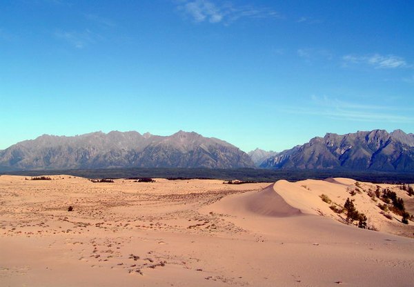 The Chara Sands, a desert like area in the middle of Siberia, as seen near Novaya Chara. The Kodar Mountains lie in the background.