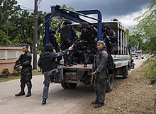 Maritime Group members prepare to move after completing a direct action training scenario as part of the Joint Interagency Task Force (JIATF) West exercise Aug. 6, 2014, in Puerto Princesa, Philippines MG members prepare to move.jpg