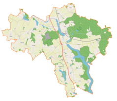 Mapa konturowa gminy Małdyty, blisko centrum po prawej na dole znajduje się punkt z opisem „Szymonowo”