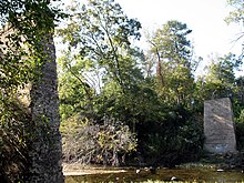 Two stone piers remain where the Nectar Covered Bridge once stood. The bridge burned down in 1993. Nectar Bridge.jpg