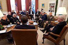 President Obama meeting in the Oval Office with Secretary Gates, the Joint Chiefs of Staff, and the Commandant of the Coast Guard on the eve of the publication of a DoD report on the repeal of DADT. Obama meets with Joint Chiefs about DADT.jpg