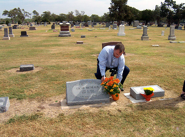 Grave of Oscar Micheaux in Great Bend being decorated during the 2005 Oscar Micheaux festival.