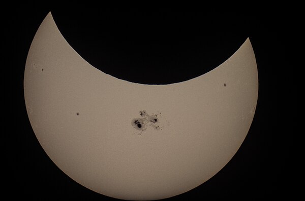 San Jose, California, 21:26 UTC. The eclipse coincided with giant sunspot region 2192, the largest seen in 24 years.