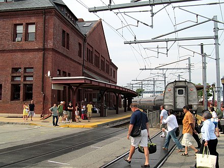 Passengers crossing the State Street crossing in New London after departing a northbound train