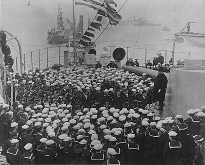 President Theodore Roosevelt addresses crewmen on Connecticut, upon her return from the Fleet's cruise around the world, 22 February 1909.