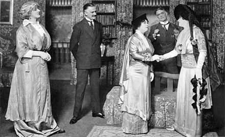 After creating the role of Col. Pickering in the London production, Philip Merivale (second from right) played Henry Higgins opposite Mrs Patrick Campbell (right) when Pygmalion was taken to Broadway (1914)