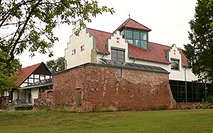 Rethem Castle as a new building from 2004 with a historic ring wall in red brick
