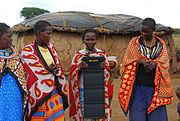 Rural African Villagers Holding Portable Solar Charger.jpg